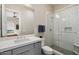 Bathroom with single vanity, walk-in shower, and gray cabinets at 16076 E Ridgestone Dr, Fountain Hills, AZ 85268