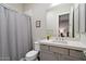Guest bathroom with single vanity, shower/tub combo, and gray decor at 16076 E Ridgestone Dr, Fountain Hills, AZ 85268