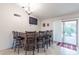 Breakfast bar with seating for five, tile flooring, and access to backyard at 9008 E Friess Dr, Scottsdale, AZ 85260