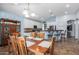 Bright dining room features a spacious table and chairs, with built-in cabinetry at 13629 W San Miguel Ave, Litchfield Park, AZ 85340