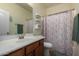 Clean bathroom with shower/tub combo, vanity, and updated fixtures at 16079 W Williams St, Goodyear, AZ 85338