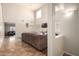 Open living room with high ceilings and a view into the dining area at 16079 W Williams St, Goodyear, AZ 85338