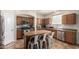 Kitchen with island, stainless steel appliances, and wood cabinets at 16079 W Williams St, Goodyear, AZ 85338