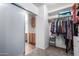 Spacious walk-in closet with ample hanging space and shelving at 16079 W Williams St, Goodyear, AZ 85338