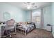Charming bedroom with a bed, desk, and window at 16079 W Williams St, Goodyear, AZ 85338