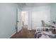 Bright bedroom with built-in desk and access to bathroom at 16079 W Williams St, Goodyear, AZ 85338