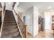 Elegant staircase with wrought iron railings leading to the upper level at 16079 W Williams St, Goodyear, AZ 85338