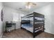 Cozy bedroom featuring a bunk bed and workspace at 16079 W Williams St, Goodyear, AZ 85338