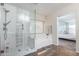 Spa-like bathroom with a glass shower and a soaking tub at 16079 W Williams St, Goodyear, AZ 85338