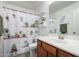 Clean bathroom with wood vanity and shower/tub combo at 16079 W Williams St, Goodyear, AZ 85338