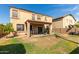 Two story house with covered patio and backyard at 16079 W Williams St, Goodyear, AZ 85338