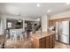 Kitchen with an island, breakfast nook, and stainless steel appliances at 16079 W Williams St, Goodyear, AZ 85338