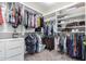 Large walk-in closet with shelves and hanging rods at 16079 W Williams St, Goodyear, AZ 85338