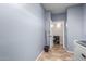 Laundry room with built-in shelving and storage at 16079 W Williams St, Goodyear, AZ 85338