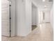 Bright hallway with tile flooring and a door leading to another room at 14436 W Faye Way, Surprise, AZ 85387