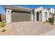 Modern stucco home with a two-car garage and desert landscaping at 14436 W Faye Way, Surprise, AZ 85387