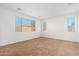 Bright bedroom with neutral carpeting and window blinds at 14436 W Faye Way, Surprise, AZ 85387