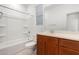 Clean bathroom with tub, shower, and wood vanity at 14436 W Faye Way, Surprise, AZ 85387