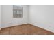 Bright bedroom with brown carpet and large window at 14436 W Faye Way, Surprise, AZ 85387