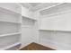 Large walk-in closet with shelving and hanging rods at 14436 W Faye Way, Surprise, AZ 85387