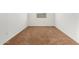 Simple carpeted bedroom with a window and neutral walls at 14436 W Faye Way, Surprise, AZ 85387