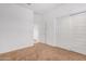 Spacious bedroom with double doors and carpet at 14436 W Faye Way, Surprise, AZ 85387