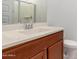 Bathroom with single sink and wood cabinets at 14436 W Faye Way, Surprise, AZ 85387