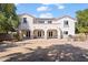 Two-story home with covered patio and grassy backyard at 4517 W Lodge Dr, Laveen, AZ 85339