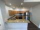 Modern kitchen featuring granite countertops and stainless steel appliances at 14000 N 94Th St # 1037, Scottsdale, AZ 85260