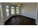 Well lit bedroom with hardwood floors and arched windows at 14000 N 94Th St # 1037, Scottsdale, AZ 85260