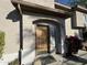 Townhome with a wood front door and red flowers at 14000 N 94Th St # 1037, Scottsdale, AZ 85260