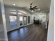 Bright living room with hardwood floors, vaulted ceilings, and access to a private balcony at 14000 N 94Th St # 1037, Scottsdale, AZ 85260