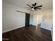 Spacious bedroom with ceiling fan and barn door at 14000 N 94Th St # 1037, Scottsdale, AZ 85260
