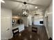 Open concept dining area with hardwood floors and modern lighting at 14000 N 94Th St # 1037, Scottsdale, AZ 85260