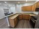 Modern kitchen with granite countertops and wood cabinets at 14000 N 94Th St # 1037, Scottsdale, AZ 85260