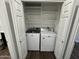 Laundry area with washer, dryer, and shelving at 14000 N 94Th St # 1037, Scottsdale, AZ 85260