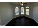 Bright bedroom with hardwood floors and large windows at 14000 N 94Th St # 1037, Scottsdale, AZ 85260