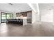 Modern kitchen with marble countertops, stainless steel appliances, and an island with seating at 930 W Maryland Ave, Phoenix, AZ 85013