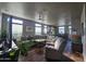 Relaxing living room with L-shaped sofa, large TV, and ceiling fan at 650 N Hawes Rd # 3820, Mesa, AZ 85207