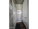 Inviting entryway with two white doors, wood-look floors, and wall art at 650 N Hawes Rd # 3820, Mesa, AZ 85207