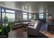 Spacious living room with sectional sofa, wood floors and lots of natural light at 650 N Hawes Rd # 3820, Mesa, AZ 85207