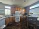 Bright kitchen with wood cabinets, white appliances, and a breakfast nook at 650 N Hawes Rd # 3820, Mesa, AZ 85207