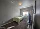 Cozy bedroom with a single bed, carpet flooring, and a TV at 650 N Hawes Rd # 3820, Mesa, AZ 85207