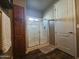 Bathroom featuring a walk-in shower and wood cabinets at 650 N Hawes Rd # 3820, Mesa, AZ 85207
