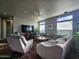 Comfortable living room featuring a sectional sofa and wood-look flooring at 650 N Hawes Rd # 3820, Mesa, AZ 85207