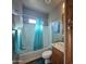 Clean bathroom with a tub shower, wood vanity, and decorative wall art at 650 N Hawes Rd # 3820, Mesa, AZ 85207