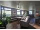Open living room with a comfortable sectional sofa and tile floor at 650 N Hawes Rd # 3820, Mesa, AZ 85207