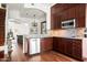 Well-equipped kitchen featuring dark wood cabinets at 4955 E Indian School Rd # 9, Phoenix, AZ 85018