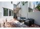 Relaxing patio with seating area and spiral staircase at 4955 E Indian School Rd # 9, Phoenix, AZ 85018