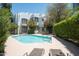 Relaxing pool area with lounge chairs and a view of the house at 4955 E Indian School Rd # 9, Phoenix, AZ 85018